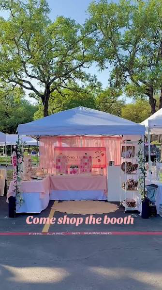 Supporting a local ribbon flower business at a booth.