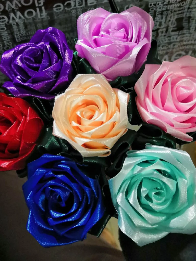 Multi colored ribbon roses. Red, Purple, Pink, Lilac, Blue, Green and Cream. 